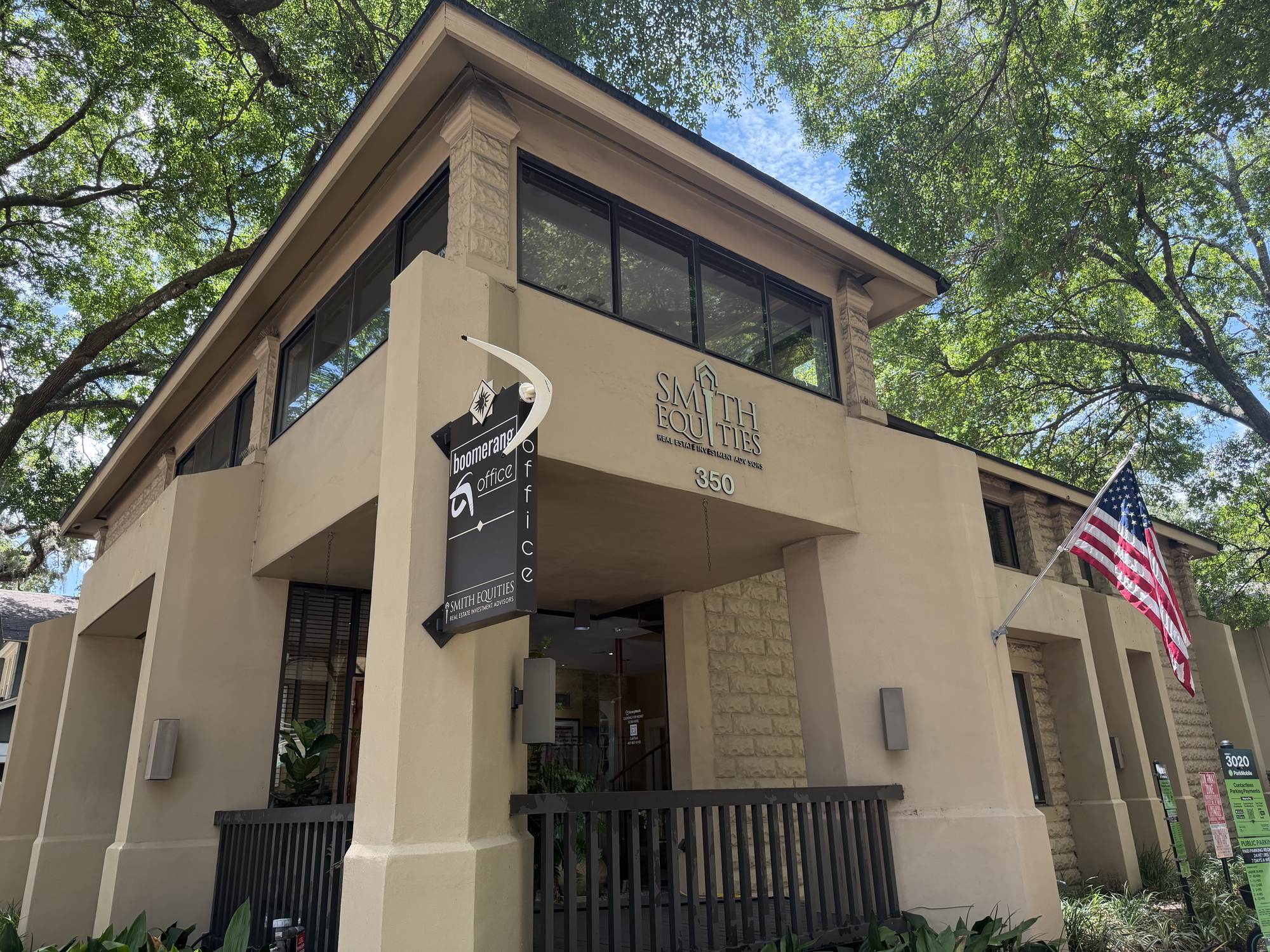 Historic 350 E. Pine Street building exterior with front porch and American flag in downtown Orlando