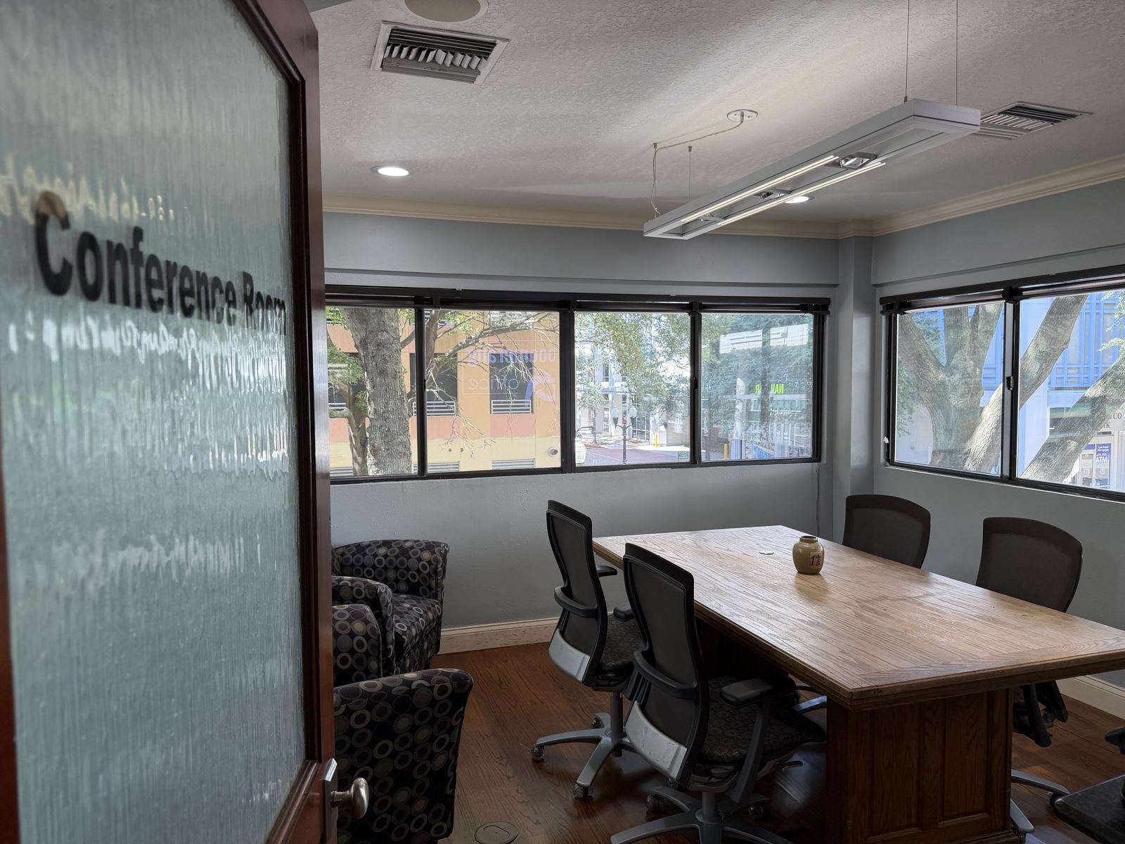 Private second-floor conference room with natural light at BoomerangOffice, downtown Orlando